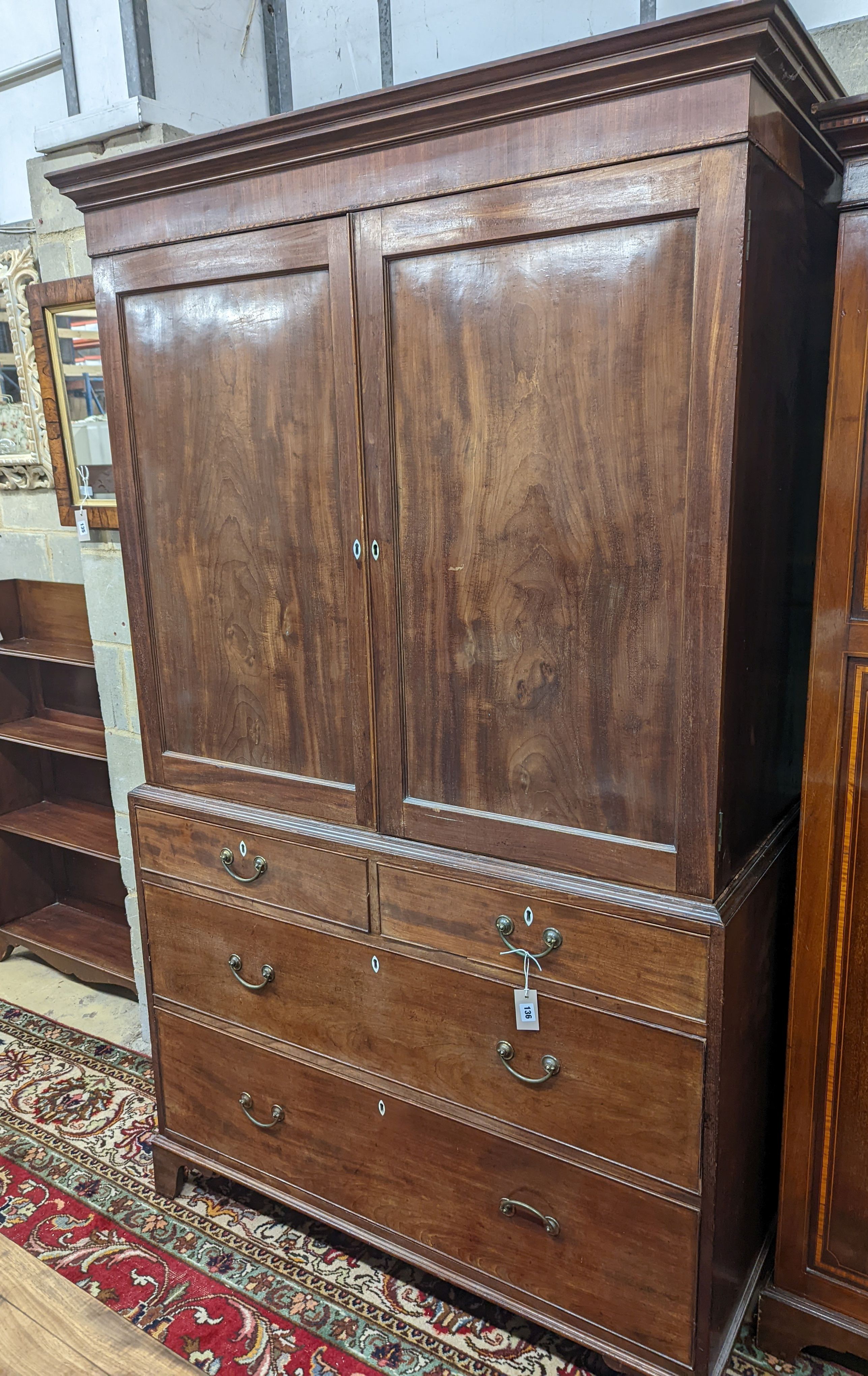 A George III mahogany linen press, length 122cm, depth 59cm, height 203cm